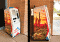Two views of a utility payment kiosk located outside a building. The kiosk boasts a colorful design with a desert landscape, including cacti and a cooling sunset, alongside the text Mesa AZ.