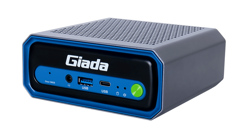 A compact, rectangular Giada mini PC designed for AI computers, featuring a gray vented top, blue and black front panel with a green power button, USB ports, and sleek branding.