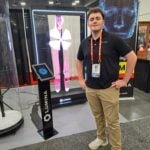 Henry Lober introduces interactive AI avatar holograms at the Lumina exhibit.