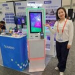 Rainbow Lei showcases the Cardmaster V8 kiosk that allows guests to register and buy new membership cards at the Nano exhibit.