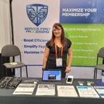 Ashley Wright offers information on automated payment services at the Service First Processing exhibit.